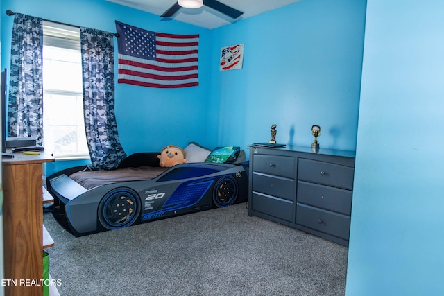 bedroom with ceiling fan and carpet