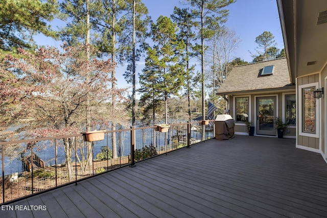 wooden deck with a water view