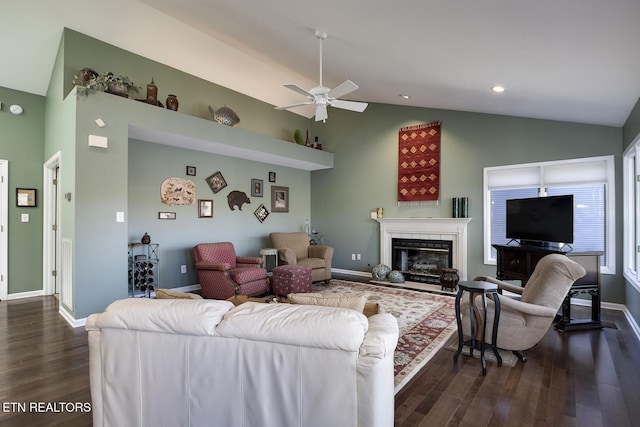 living room featuring ceiling fan, dark hardwood / wood-style flooring, and lofted ceiling