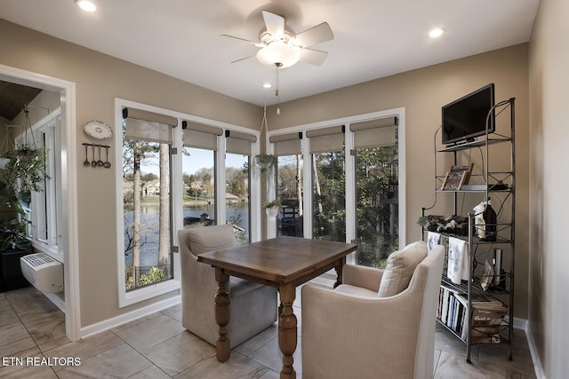 dining space with light tile patterned floors, ceiling fan, and a wealth of natural light