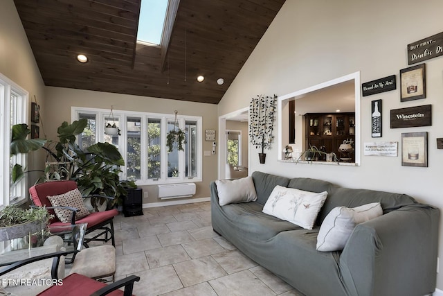 tiled living room featuring a healthy amount of sunlight, a skylight, wood ceiling, and high vaulted ceiling