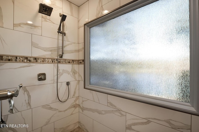 bathroom with tiled shower