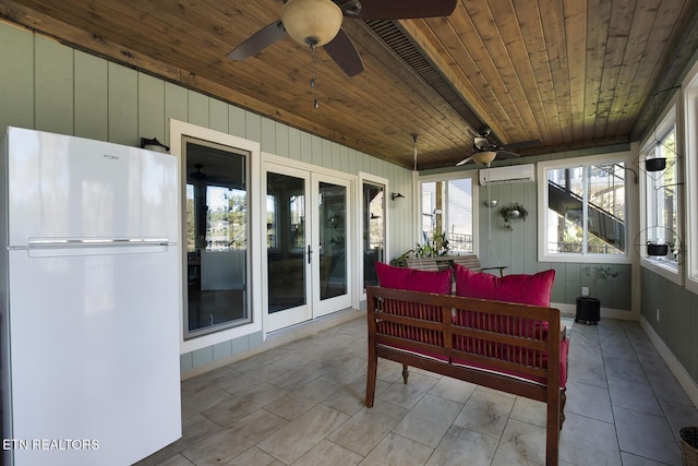 sunroom / solarium featuring a wall mounted AC, wood ceiling, and french doors