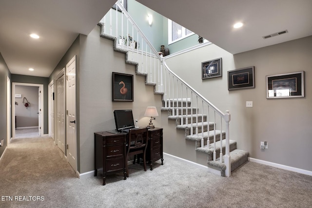 stairs featuring carpet