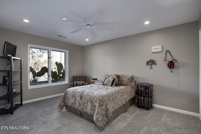 bedroom with ceiling fan and light colored carpet