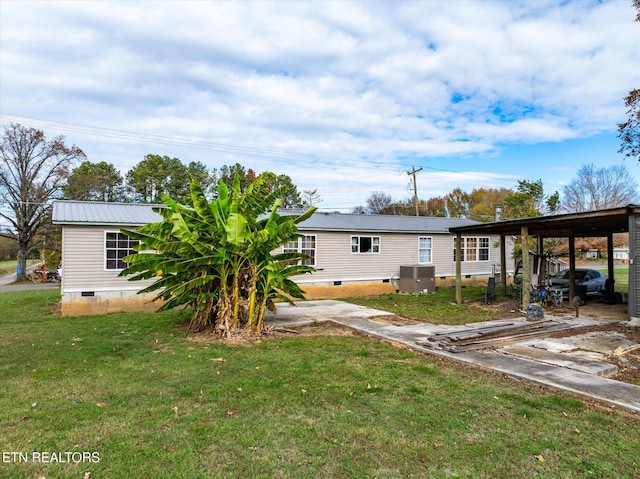 exterior space featuring cooling unit and a carport