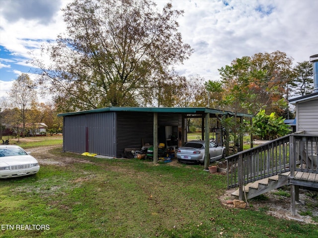 view of outbuilding featuring a yard