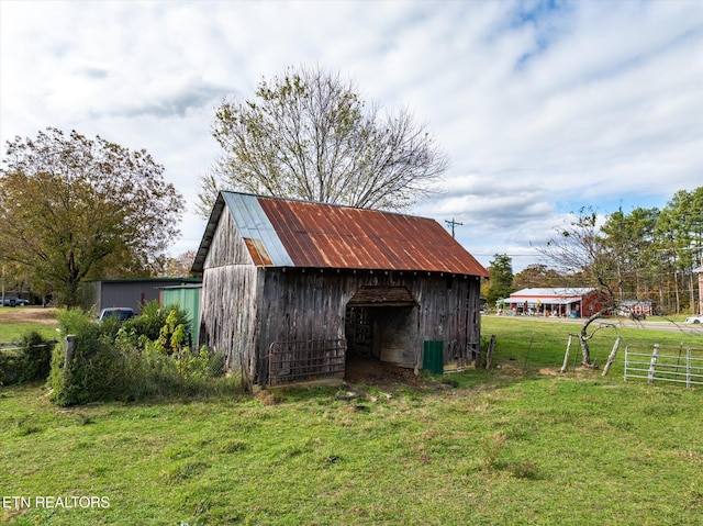 view of outbuilding with a lawn