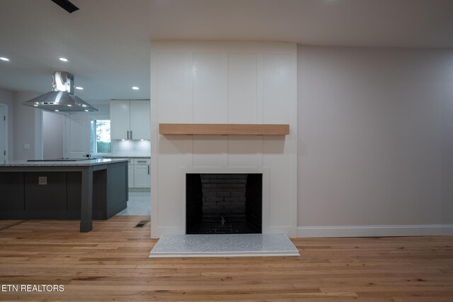 304 Firestone Rd, Oak Ridge, TN 37830 - unfurnished living room with light wood-style floors, recessed lighting, baseboards, and a large fireplace