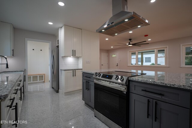 304 Firestone Rd, Oak Ridge, TN 37830 - kitchen featuring stainless steel appliances, ventilation hood, recessed lighting, white cabinetry, and tasteful backsplash