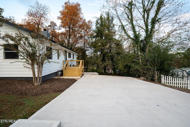 304 Firestone Rd, Oak Ridge, TN 37830 - view of side of property with a wooden deck and a chimney