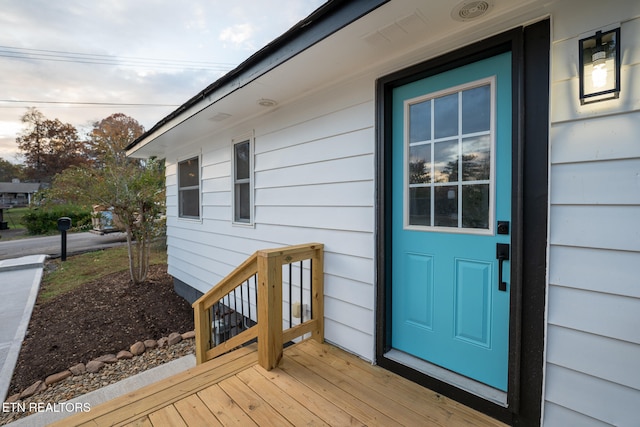 doorway to property featuring a deck