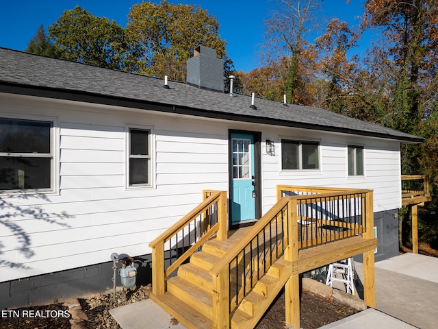 exterior space featuring a wooden deck