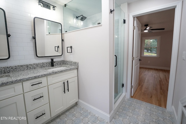 bathroom featuring an enclosed shower, wood-type flooring, vanity, and ceiling fan