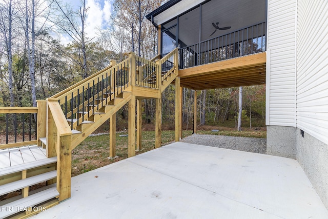 view of patio / terrace with a deck and a sunroom