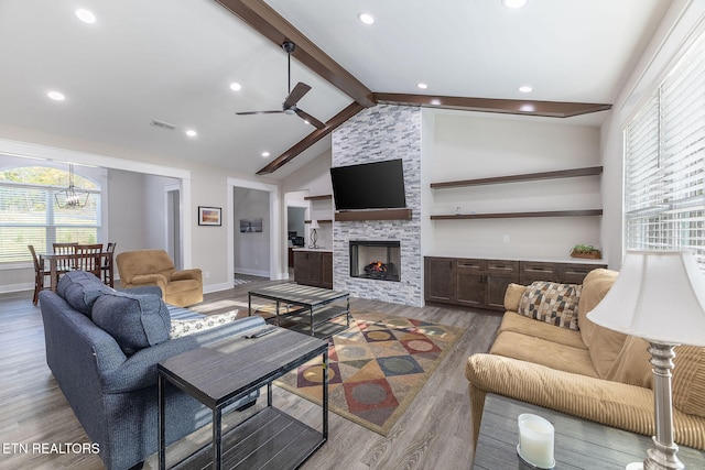 living room with lofted ceiling with beams, a fireplace, hardwood / wood-style flooring, and ceiling fan