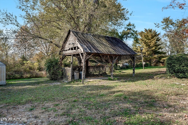 surrounding community featuring a lawn and a gazebo