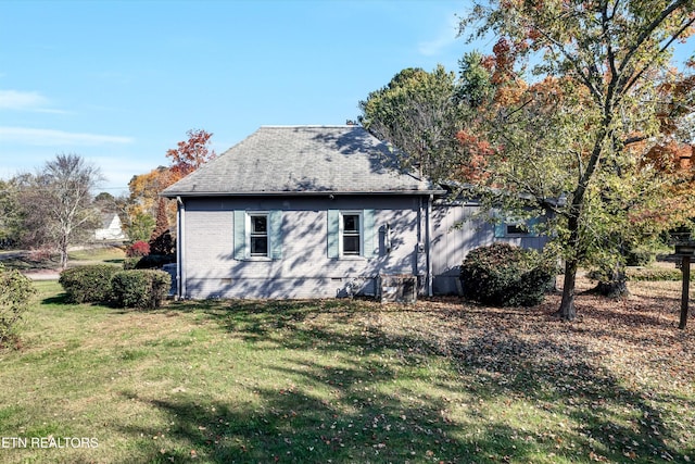 view of property exterior with a yard