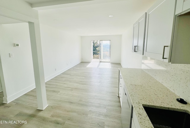 5709 Lyons View Pike Unit 4202, Knoxville, TN 37919 - unfurnished living room featuring light wood-style floors, a sink, baseboards, and recessed lighting