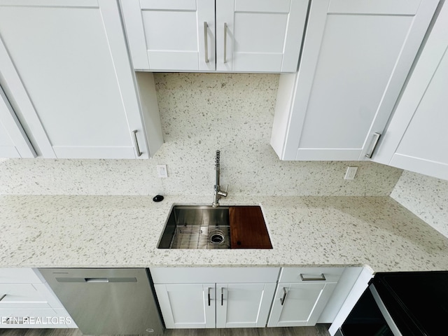 5709 Lyons View Pike Unit 4202, Knoxville, TN 37919 - kitchen with dishwasher, backsplash, white cabinetry, and a sink