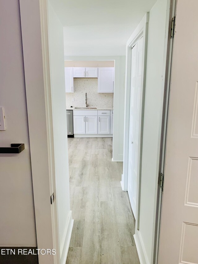 5709 Lyons View Pike Unit 4202, Knoxville, TN 37919 - hall featuring a sink and light wood-type flooring