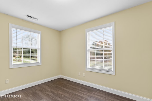 unfurnished room featuring dark hardwood / wood-style floors