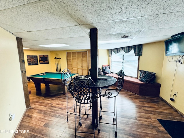 rec room with dark hardwood / wood-style flooring, a drop ceiling, and billiards