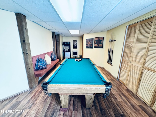 recreation room with billiards, a paneled ceiling, and wood-type flooring