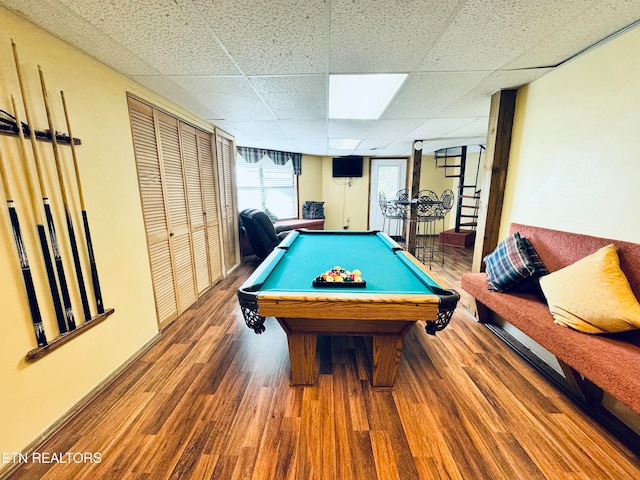 rec room featuring hardwood / wood-style floors, pool table, and a drop ceiling