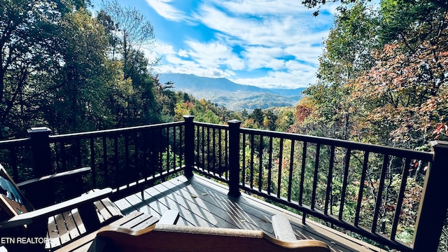 wooden terrace featuring a mountain view