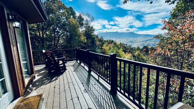 wooden terrace with a mountain view