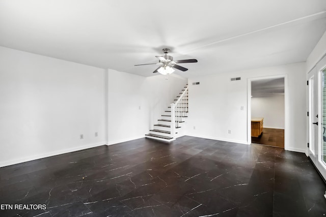 unfurnished living room with ceiling fan