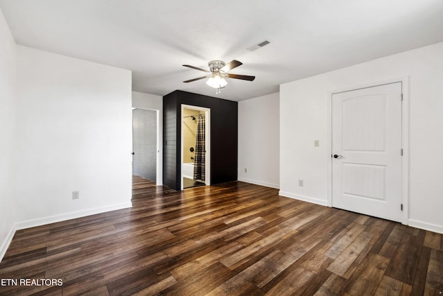 unfurnished room featuring dark hardwood / wood-style floors and ceiling fan