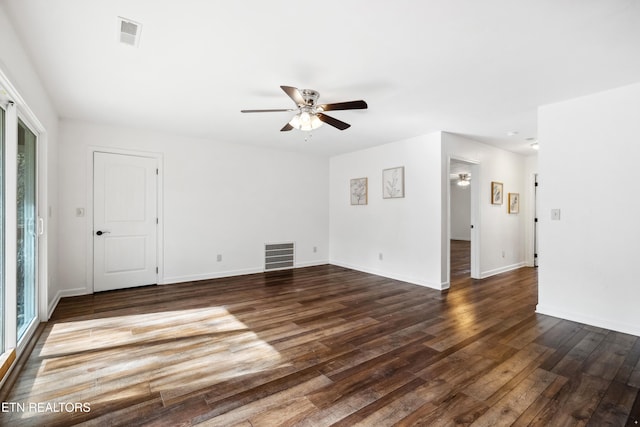 spare room featuring dark hardwood / wood-style flooring and ceiling fan