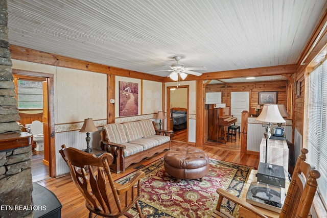 living room featuring ceiling fan, a healthy amount of sunlight, and light hardwood / wood-style floors