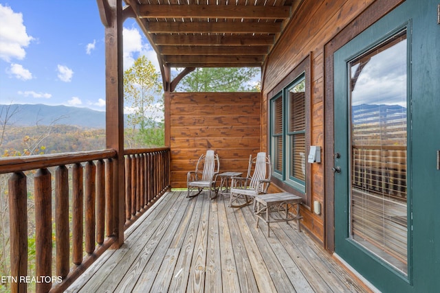 wooden terrace with a mountain view