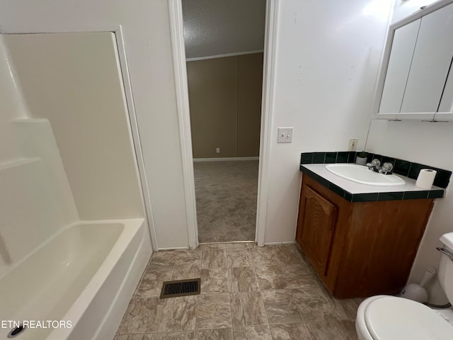 bathroom featuring vanity, toilet, and ornamental molding