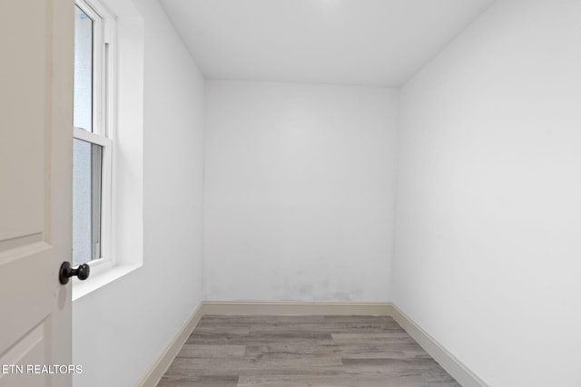 empty room featuring a wealth of natural light and light hardwood / wood-style floors