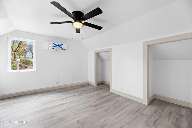 unfurnished bedroom with light hardwood / wood-style floors, lofted ceiling, and ceiling fan