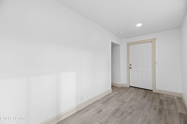 unfurnished room featuring light wood-type flooring