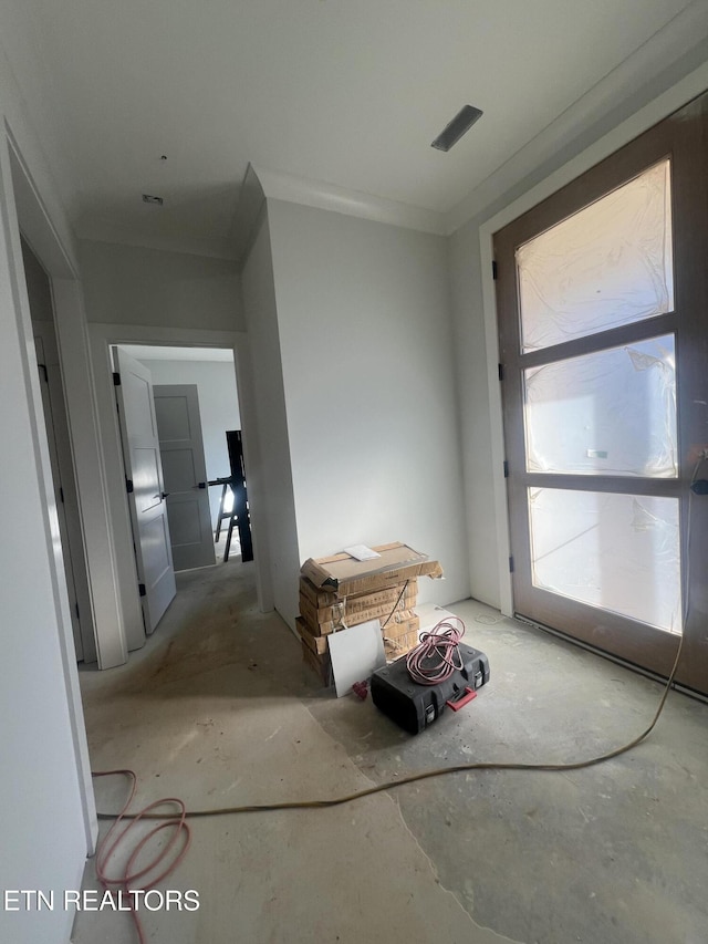 interior space with crown molding