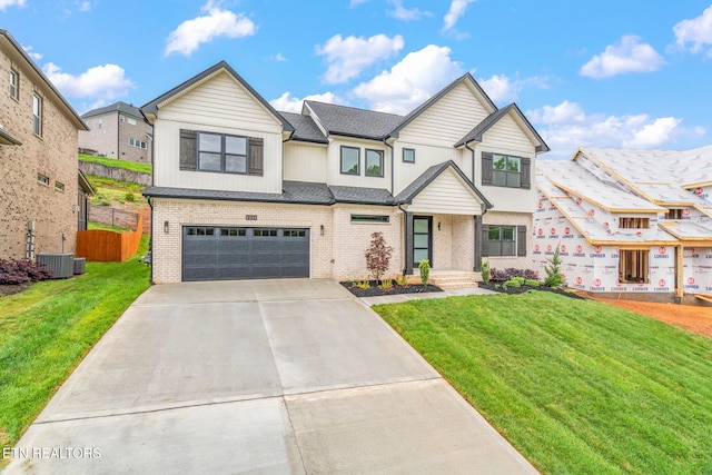 2210 Hickory Crest Ln, Knoxville, TN 37932 - view of front facade with brick siding, an attached garage, and concrete driveway