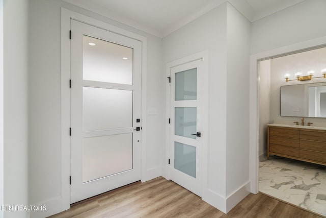 2210 Hickory Crest Ln, Knoxville, TN 37932 - doorway featuring a sink, baseboards, crown molding, light marble finish floors, and recessed lighting