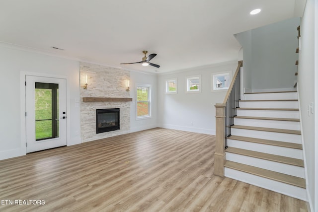 2210 Hickory Crest Ln, Knoxville, TN 37932 - unfurnished living room featuring ceiling fan, crown molding, light wood-style floors, stairway, and baseboards