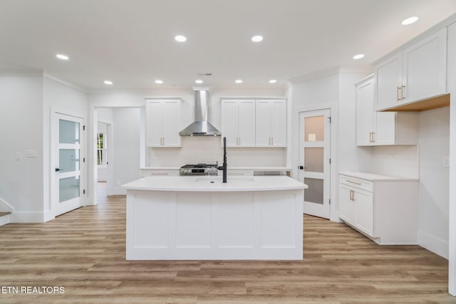 2210 Hickory Crest Ln, Knoxville, TN 37932 - kitchen featuring wall chimney exhaust hood, crown molding, light countertops, baseboards, and recessed lighting