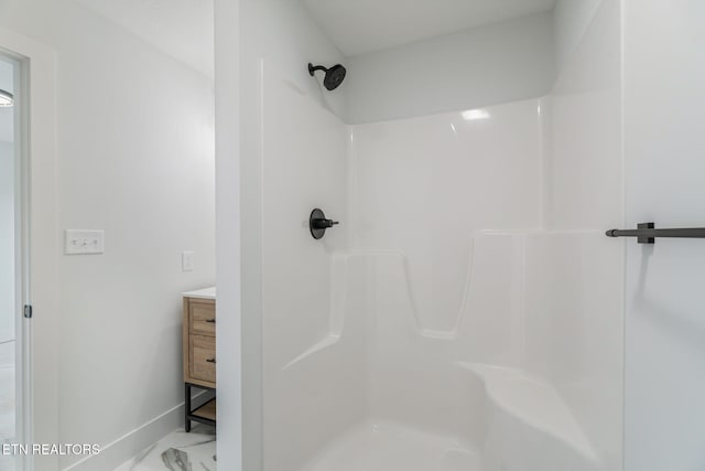 2210 Hickory Crest Ln, Knoxville, TN 37932 - bathroom with a shower, baseboards, marble finish floors, and vanity