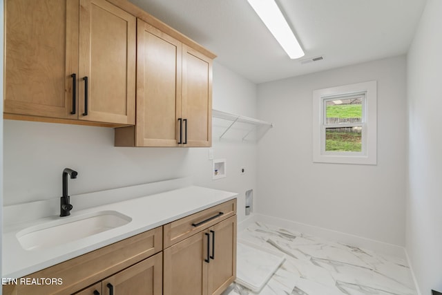 2210 Hickory Crest Ln, Knoxville, TN 37932 - laundry room featuring washer hookup, cabinet space, electric dryer hookup, light marble finish floors, and baseboards