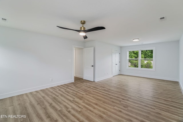 2210 Hickory Crest Ln, Knoxville, TN 37932 - unfurnished bedroom with baseboards, light wood-style floors, and ceiling fan