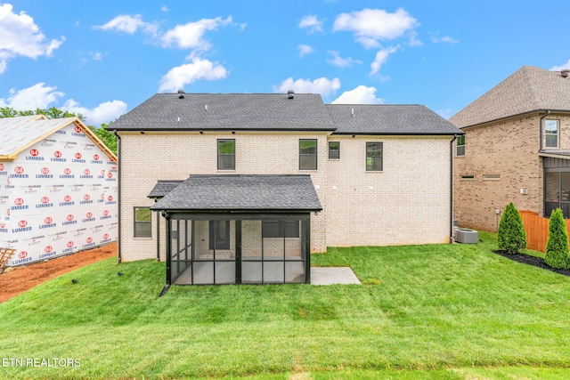 2210 Hickory Crest Ln, Knoxville, TN 37932 - rear view of property featuring a sunroom, brick siding, a shingled roof, and cooling unit