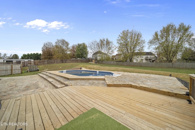 wooden deck with a swimming pool with hot tub and a lawn